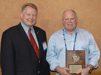 Dale Kocarek awards Steve Morrison OWEA's Larry Moon Award